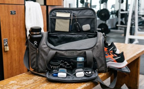 A durable quality gym bag resting on a modern gym bench.
